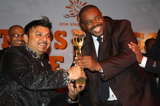 Jacob Steven (JB) receiving BEST ACTOR award from Dilesh Solanki (for the movie Nakwenda Kwa Mwanangu)